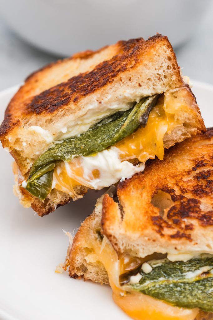 A closeup of a Jalapeño Grilled Cheese Sandwich cut in half.