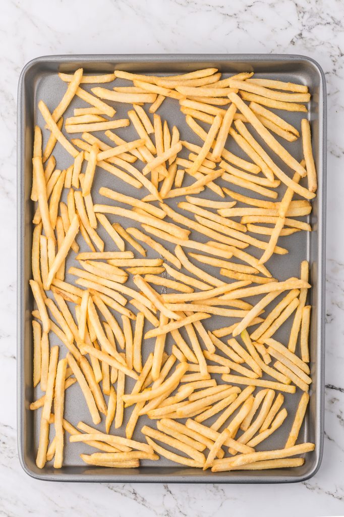 Raw fries on a pan.