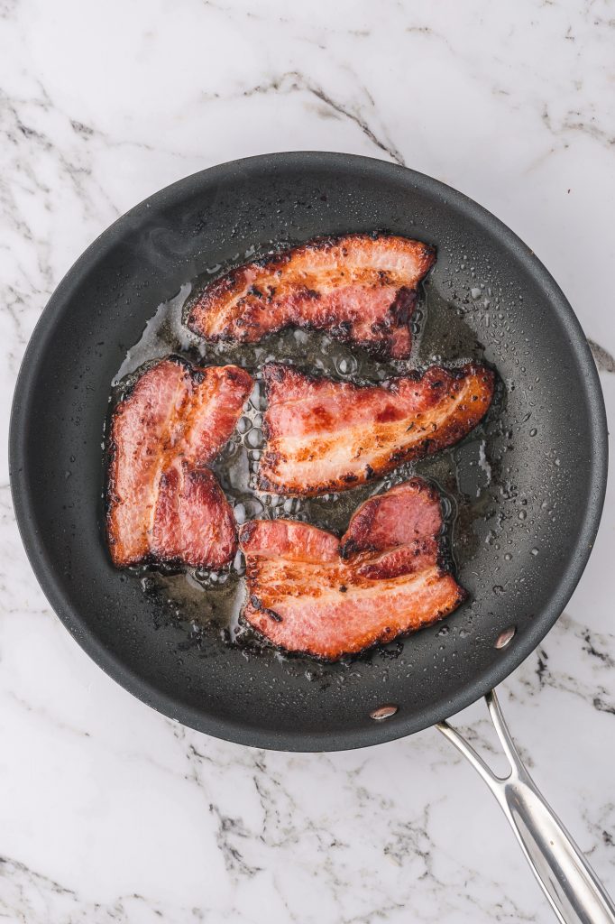 Cooked bacon in a pan.