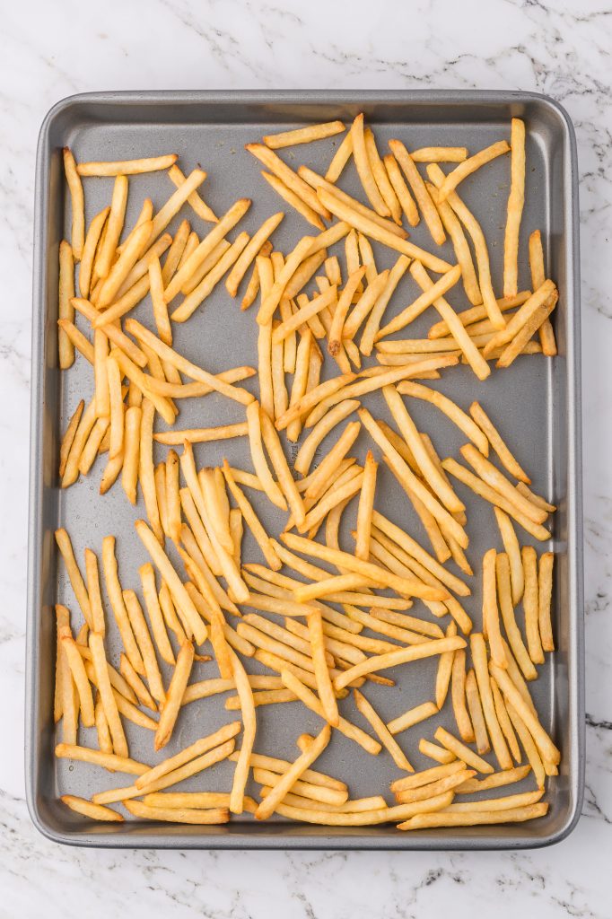 Cooked fries on a pan.