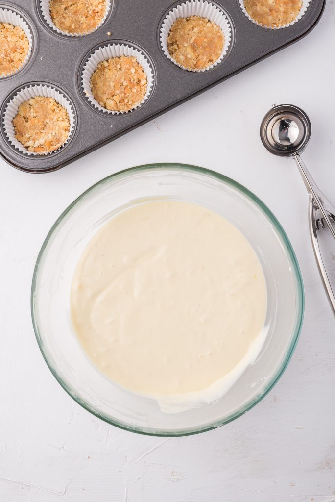 The final Mini Cheesecake Bites mixture in a glass bowl.