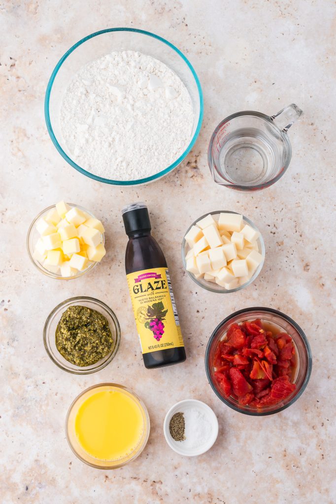 A mis-en-place of the ingredients for Caprese Empanadas.