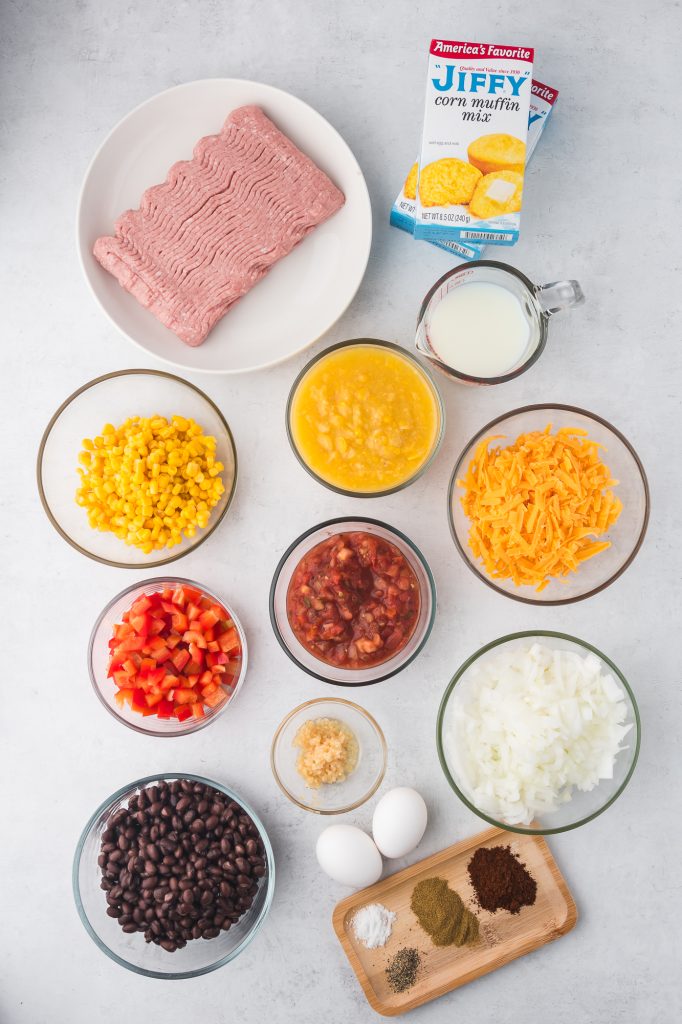 A mis-en-place of the ingredients needed for the Jiffy Mexican Cornbread Casserole.