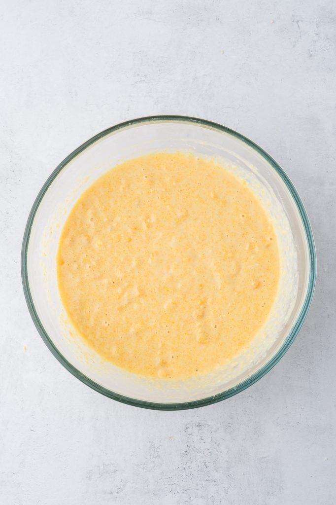 A glass bowl of mixed Jiffy Mix batter.