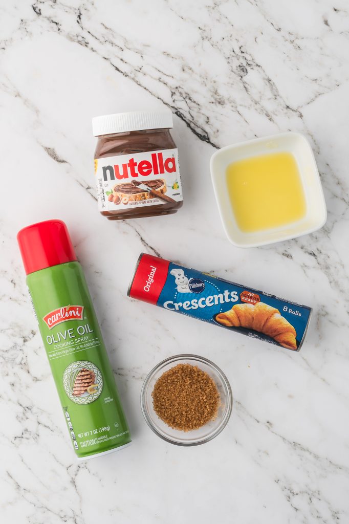 A mis-en-place of the ingredients for Nutella Croissant crescents.