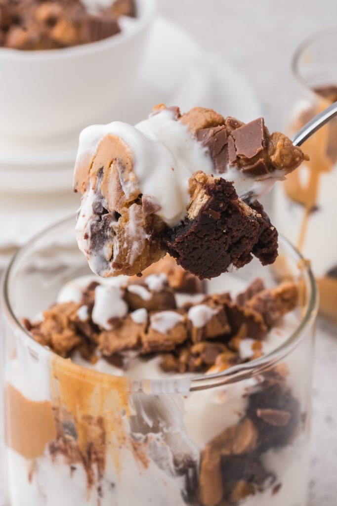 A close up of a spoonful of Peanut Butter Brownie Parfaits.