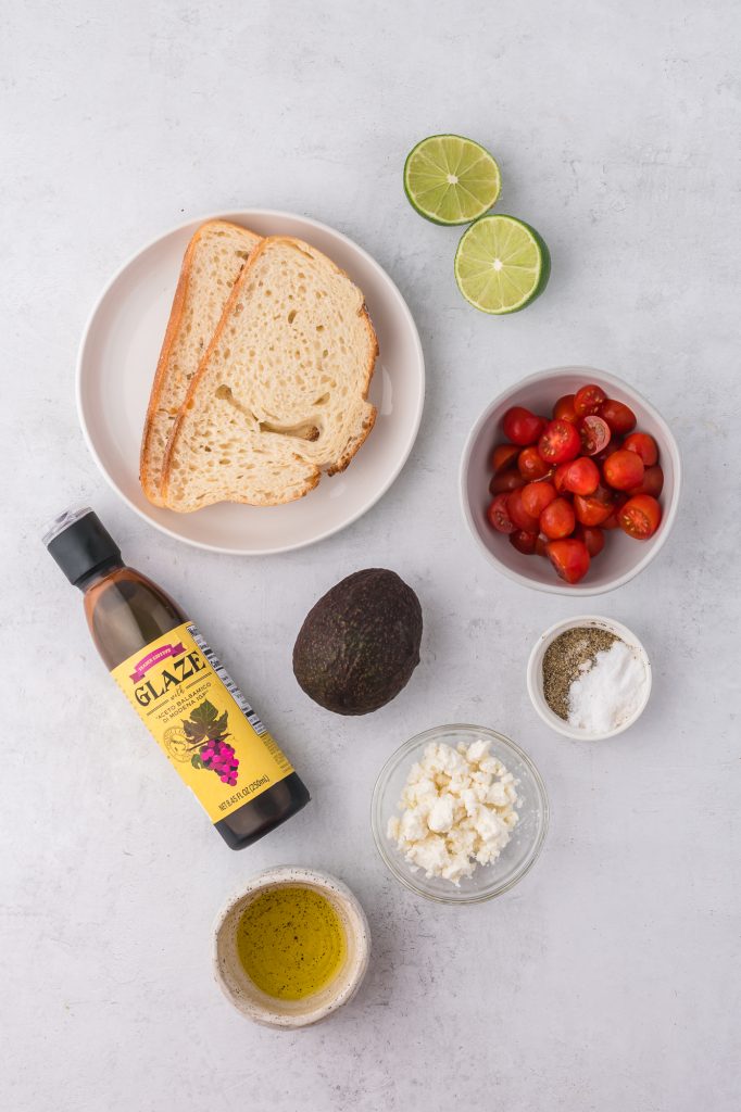 A mis-en-place of the ingredients for Avocado Toast with Tomato.