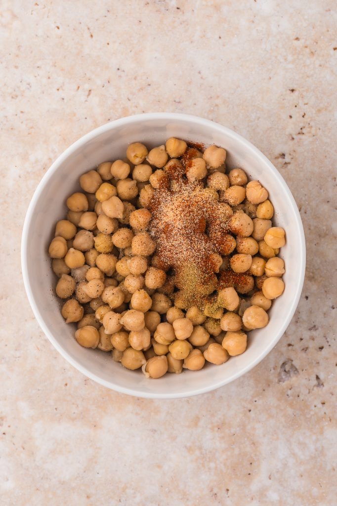 All the ingredients for Crispy Air Fryer Chickpeas in a bowl before mixed.