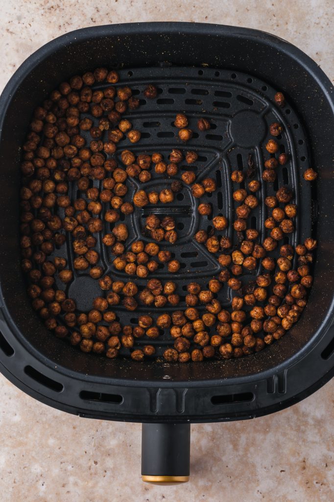 Baked Crispy Air Fryer Chickpeas in the basket of an air fryer.