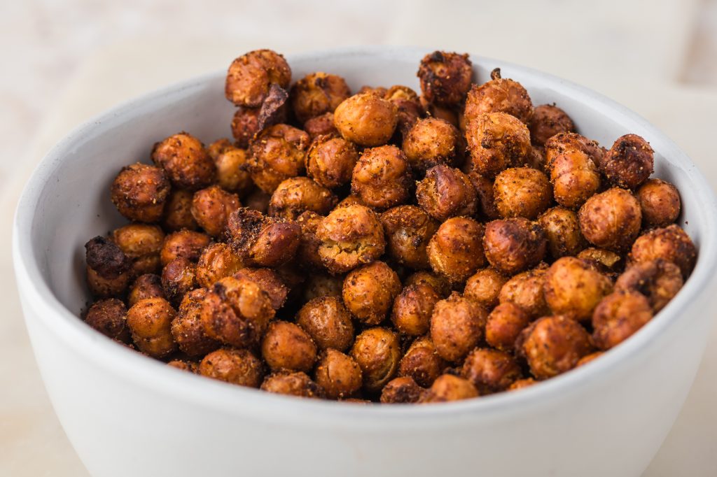 A close up of a bowl full of Crispy Air Fryer Chickpeas.