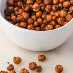 A white bowl full of Crispy Air Fryer Chickpeas.