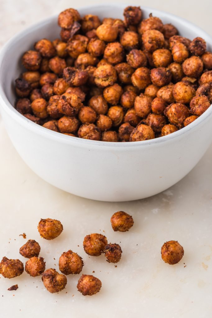 A white bowl full of Crispy Air Fryer Chickpeas.