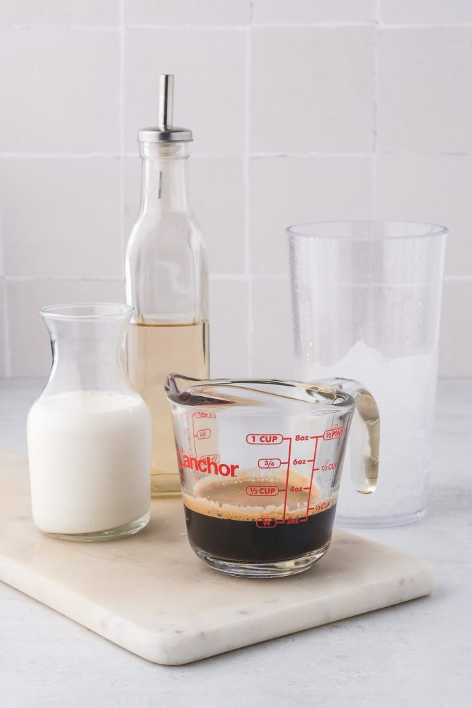 A measuring cup with the espresso for Double Shot Iced Shaken Espresso.