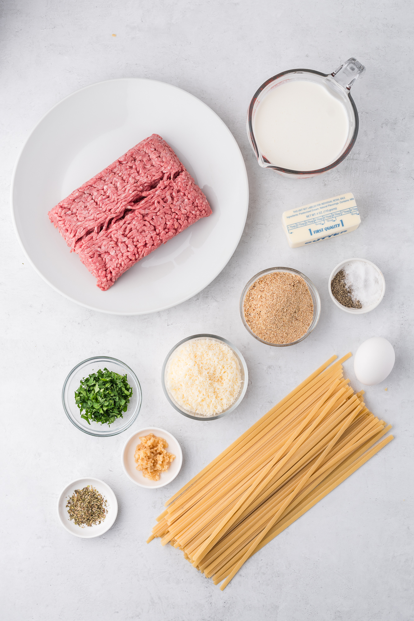 A mis-en-place of ingredients for Alfredo and Meatballs.