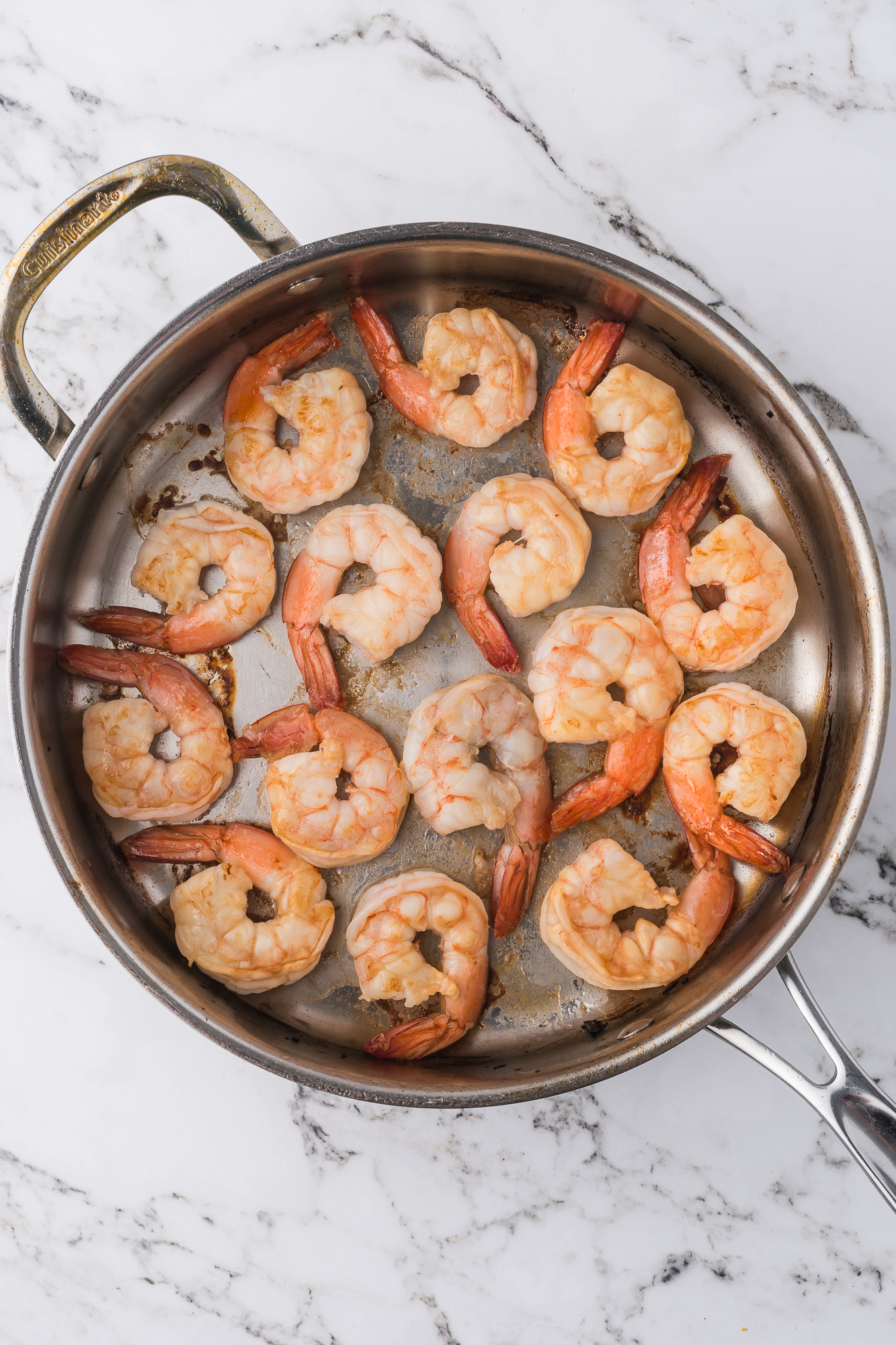 A pan of shrimp getting cooked for Shrimp Chow Mein.