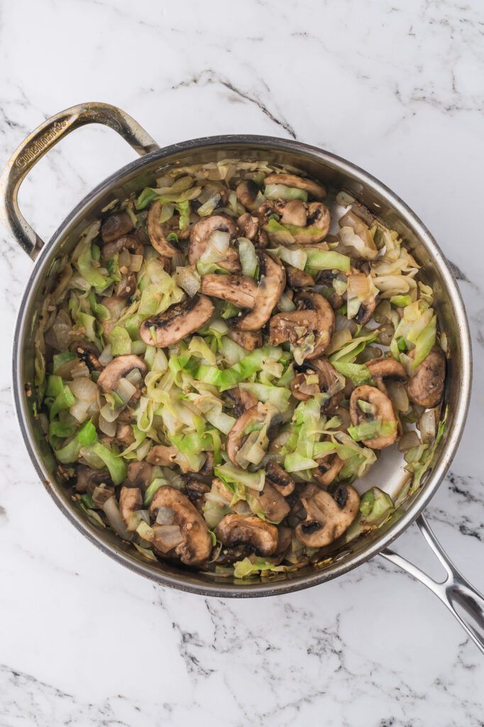 A medley of vegetables getting sauteed for Shrimp Chow Mein.