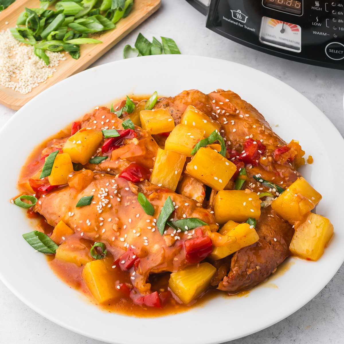 A white bowl of Slow Cooker Hawaiian Chicken.