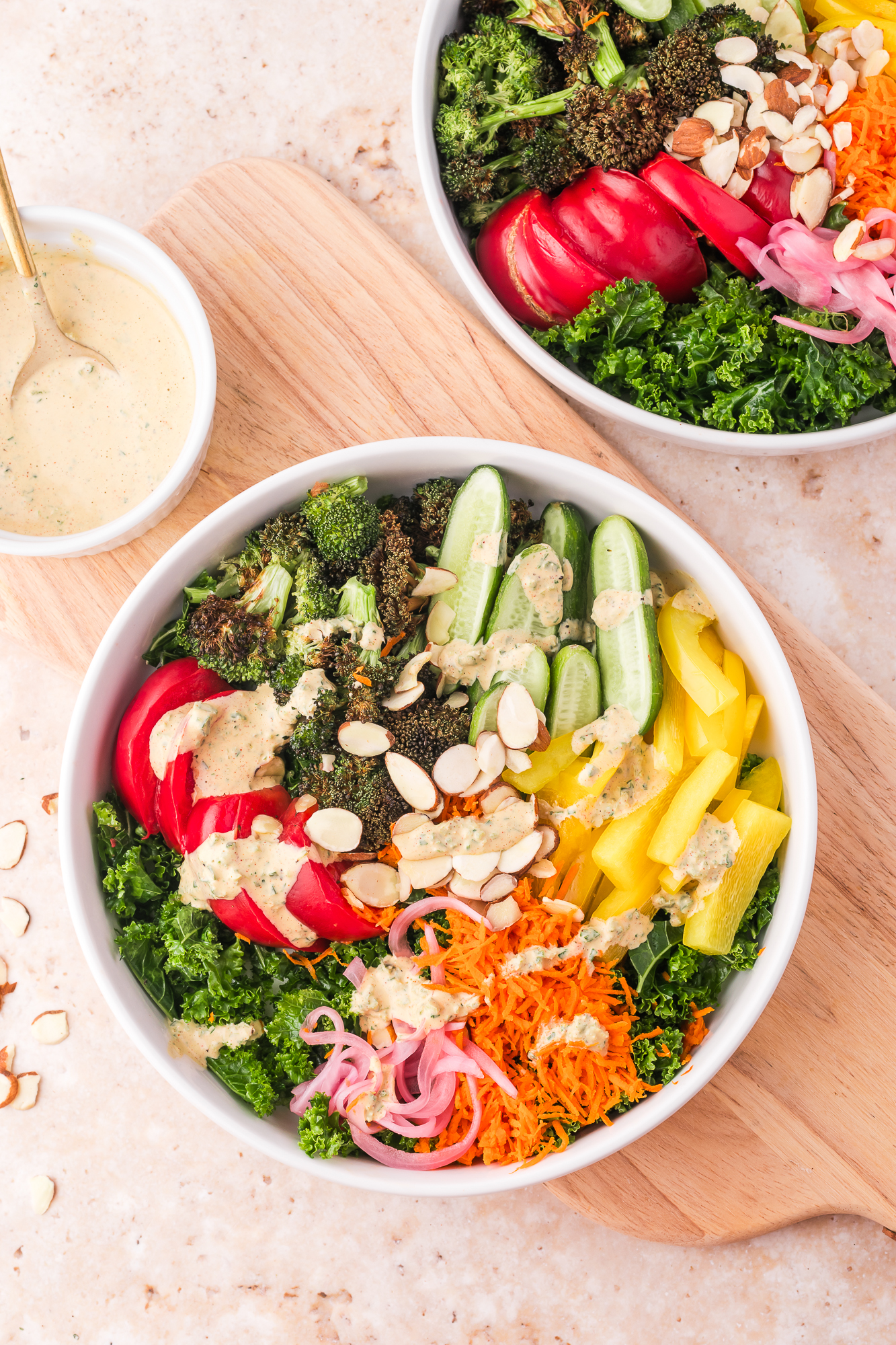 A white bowl of Kale Broccoli Salad.