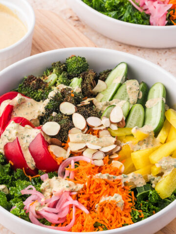 A white bowl of Kale Broccoli Salad.