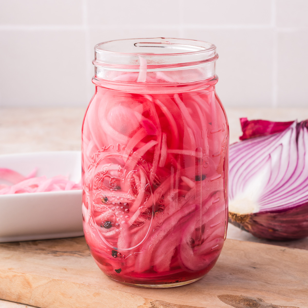 A mason jar of Pickled Red Onions,