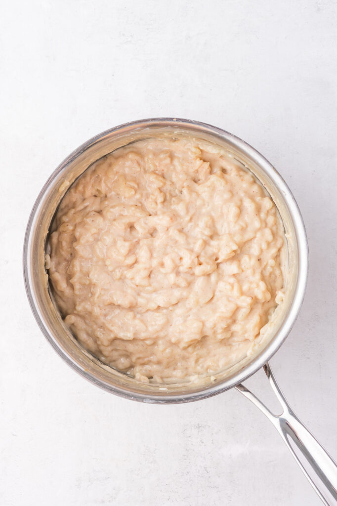 A saucepan of cooked Rice Pudding with Condensed Milk.