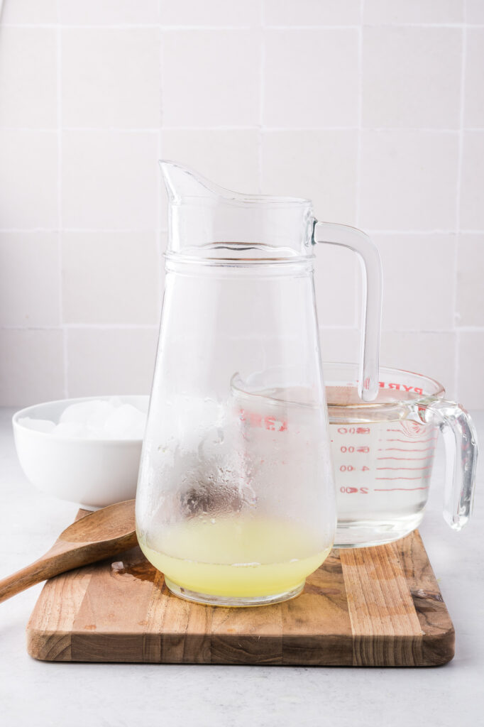 A pitcher of lemon juice and simple syrup for State Fair Lemonade.