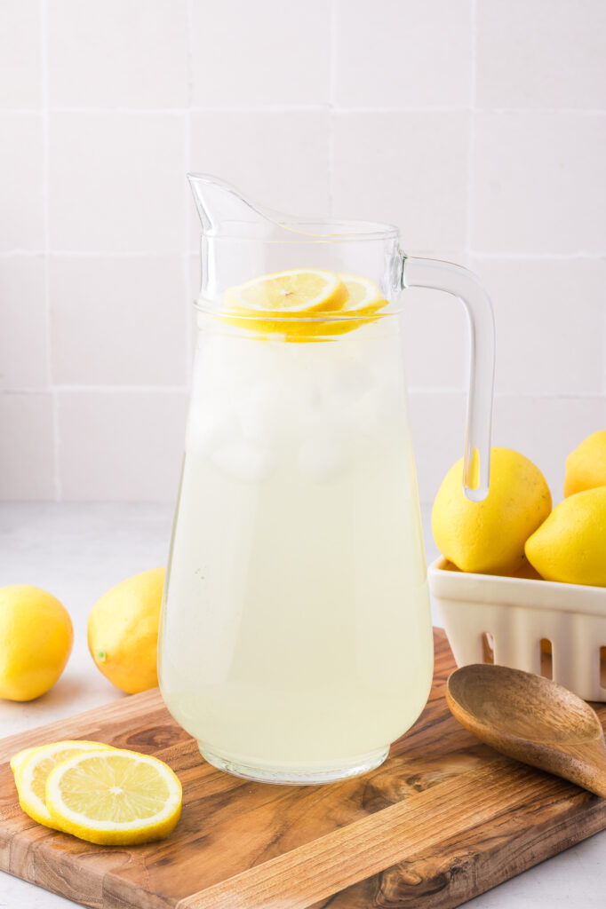 A pitcher of State Fair Lemonade garnished on top with lemon slices.