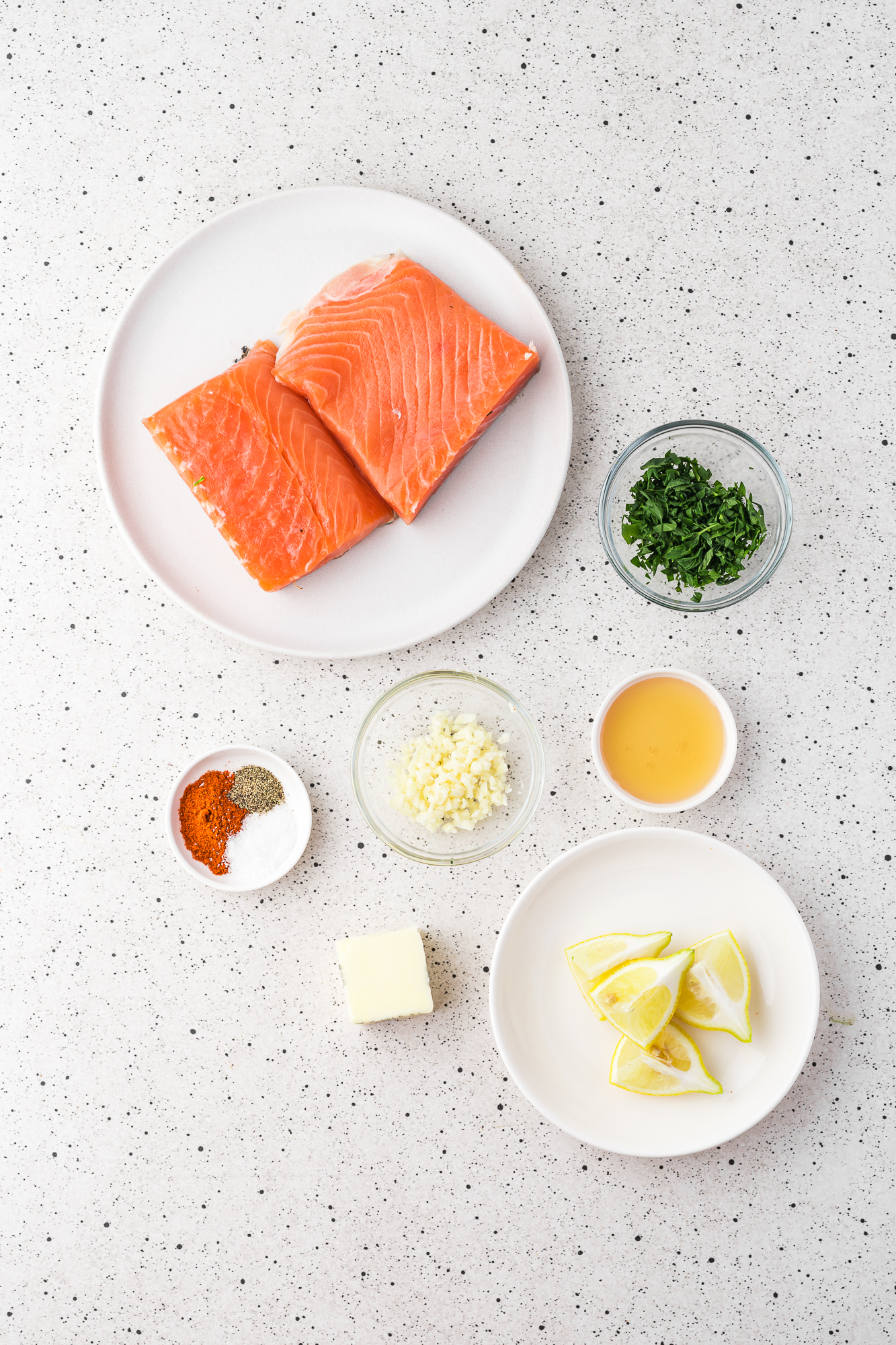 A mis-en-place of ingredients for Air Fryer Garlic Butter Salmon.