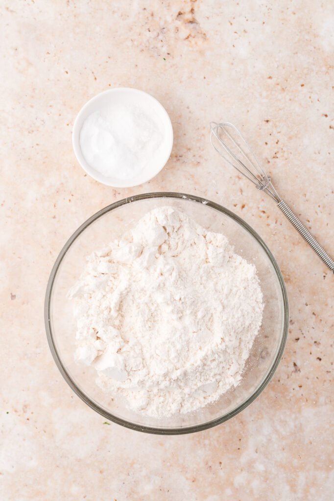 A glass bowl of the dry ingredients mixed together.