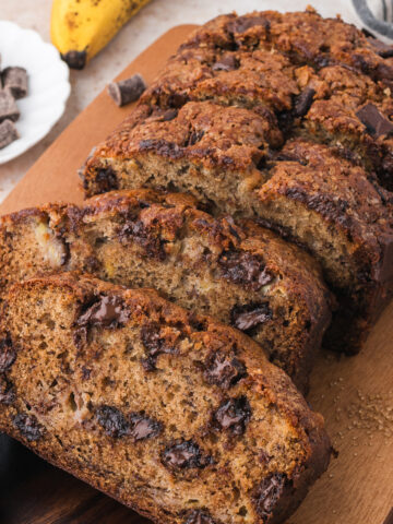 A sliced loaf of Chocolate Chunk Banana Bread.