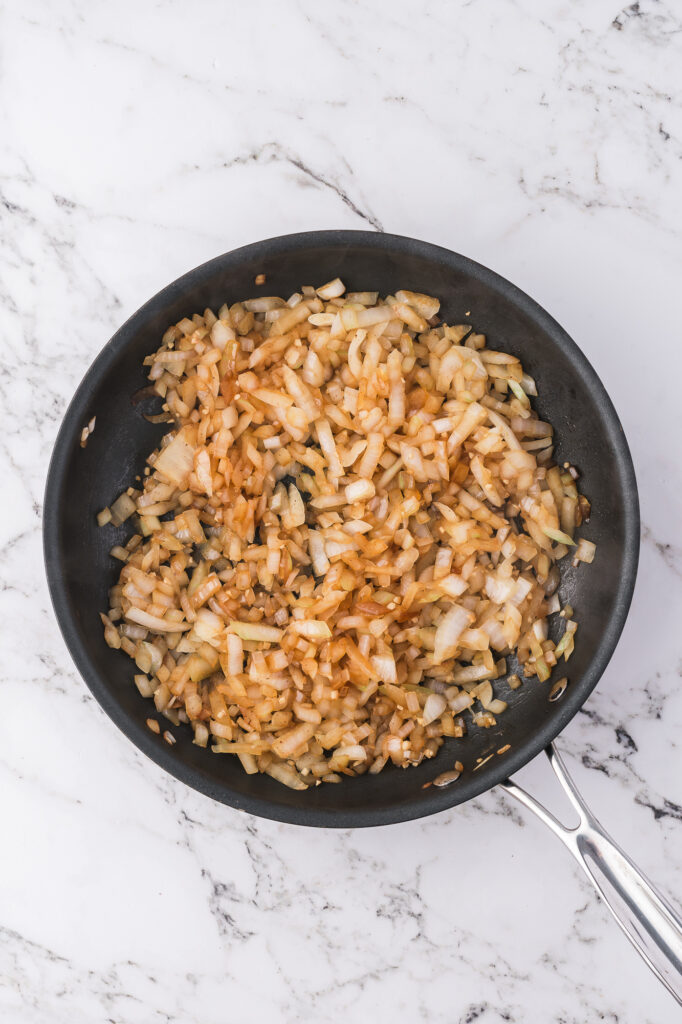 A pan of browned chopped onion.