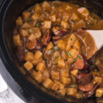 A pot of Slow Cooker Sausage Potato Casserole.