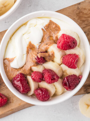 Whipped Cottage Cheese Bowls with raspberries, bananas, and almond butter.