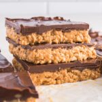 A stack of three Crispy Peanut Butter Chocolate Bars.