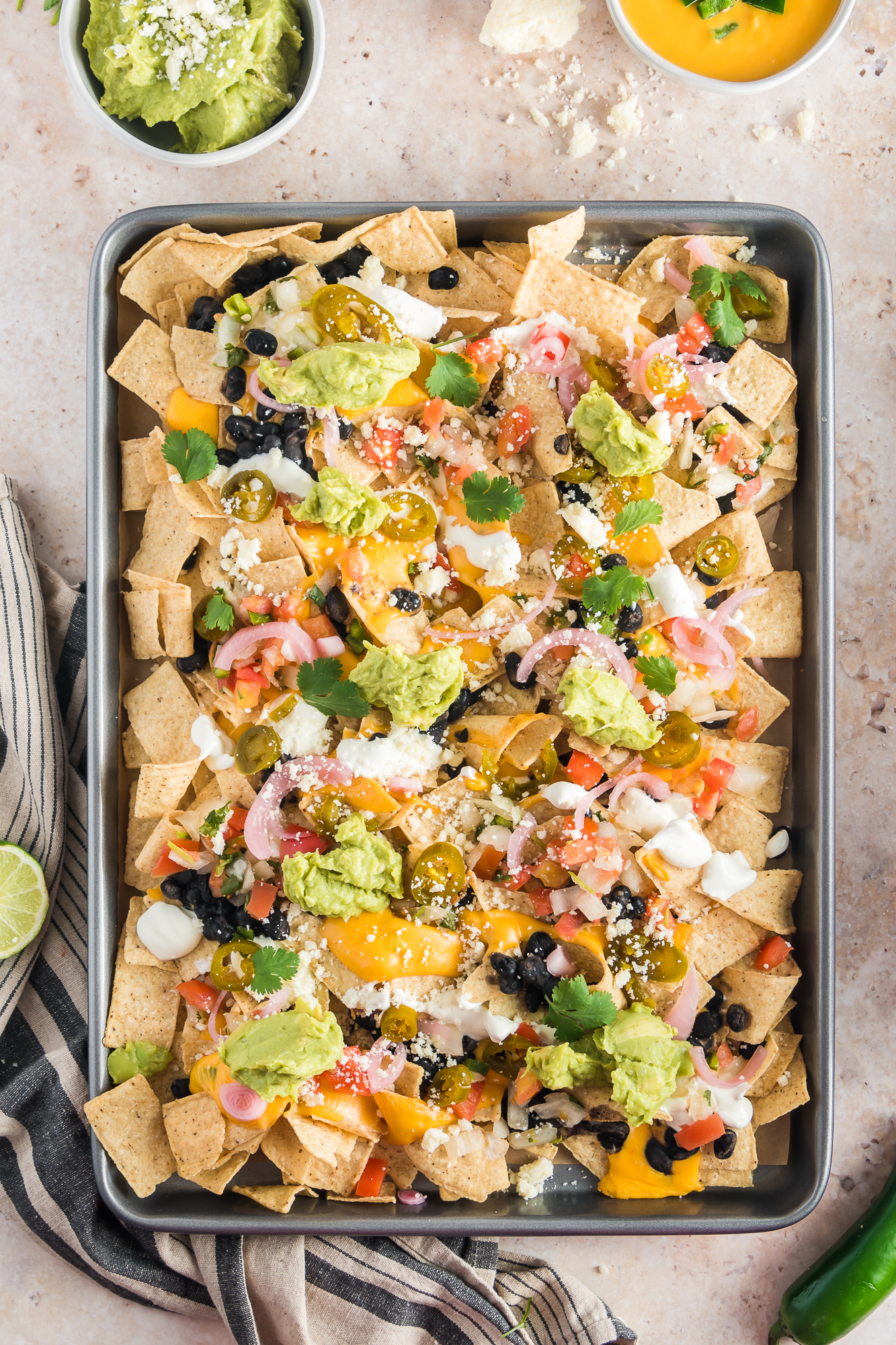 A baking sheet of Sheet Pan Nachos.