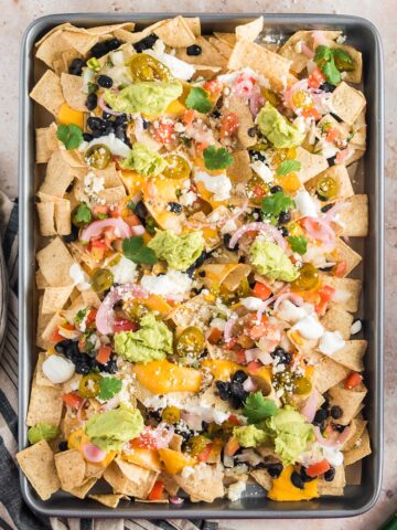 A baking sheet of Sheet Pan Nachos.