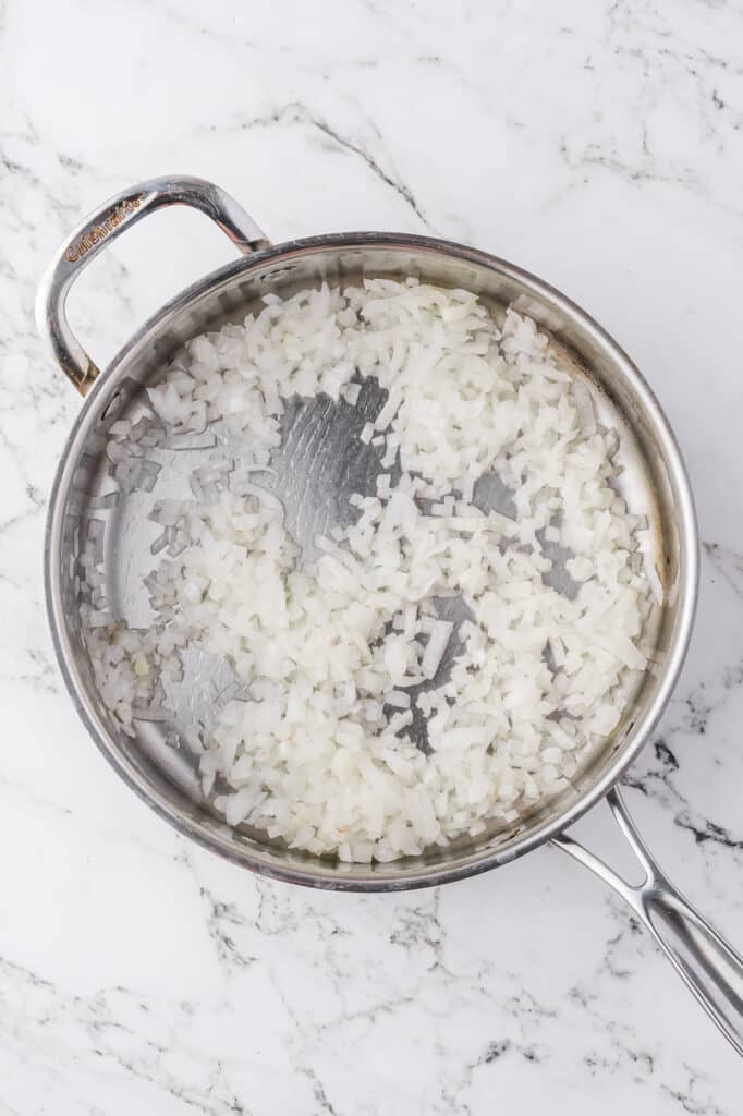 Sauteed onions in a pot.