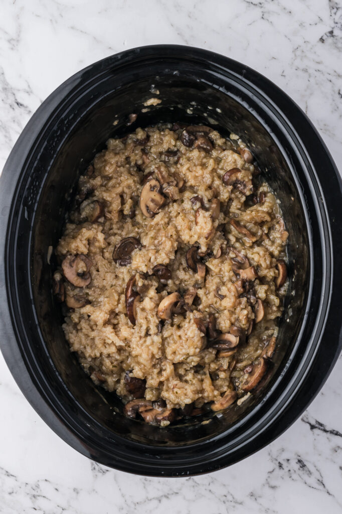 The cook Slow Cooker Mushroom Risotto in the slow cooker.