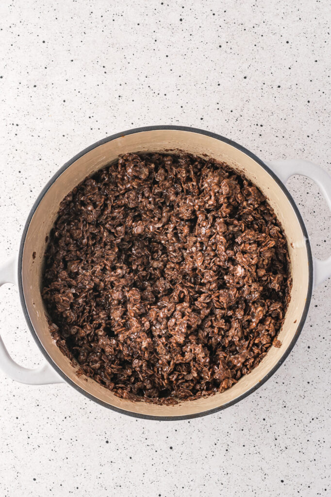 A pot of Cocoa Pebbles mixed in with the melted butter and marshmallow.