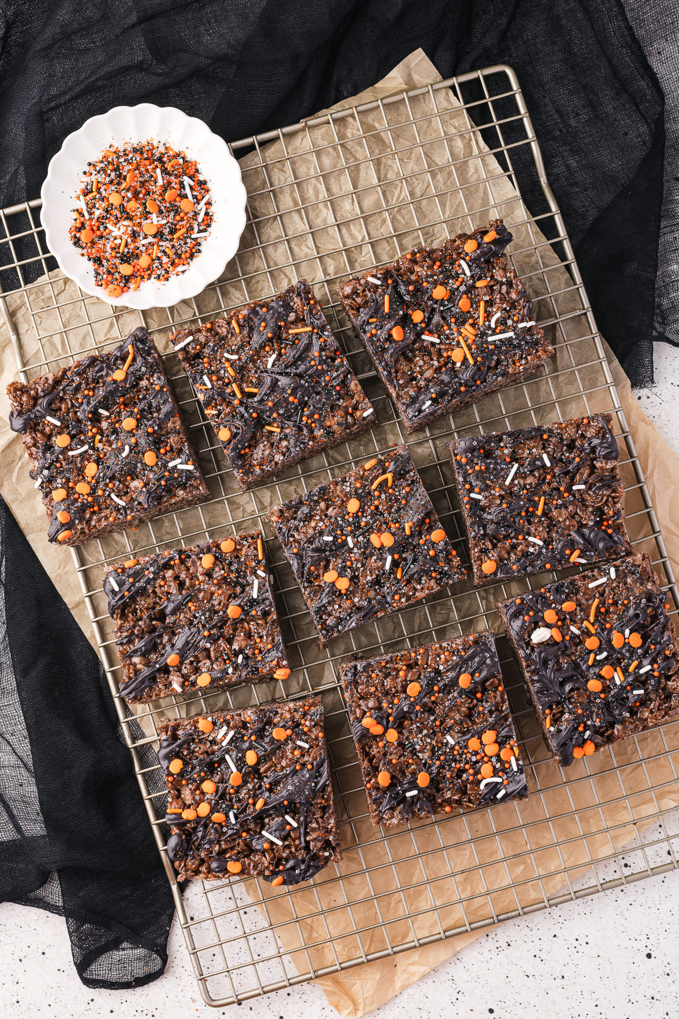 The sliced Spooky Cocoa Pebbles Treats, drizzled with the candy melts, and topped with spooky sprinkles.