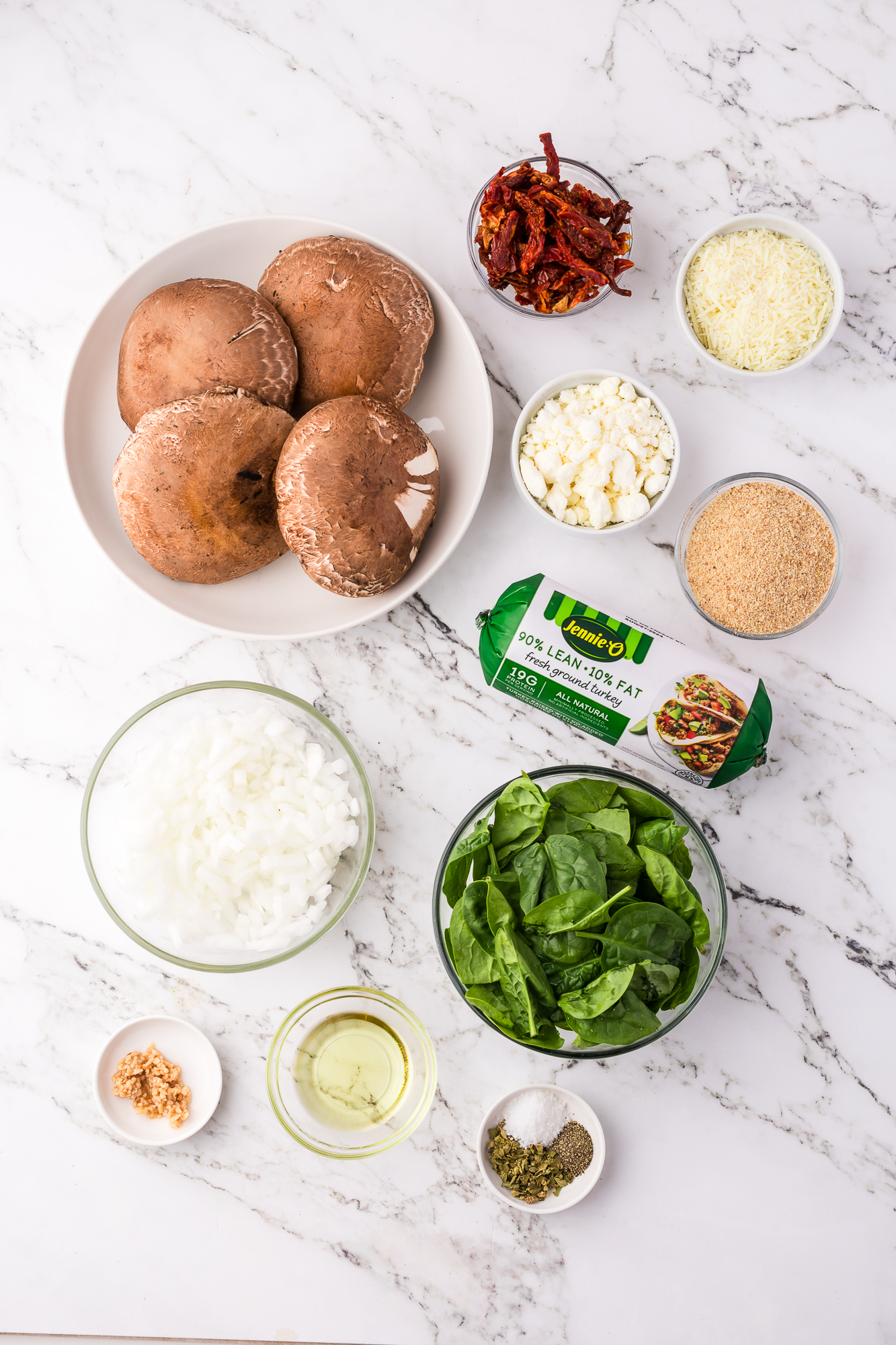 A mis-en-place of ingredients for Stuffed Portobello Mushrooms.