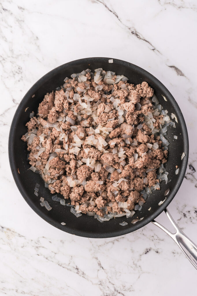 A skillet with a turkey mixture.