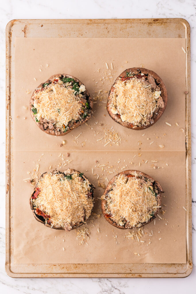 Four portobello mushrooms stuff with the turkey mixture and topped with the breadcrumb mixture for Stuffed Portobello Mushrooms.