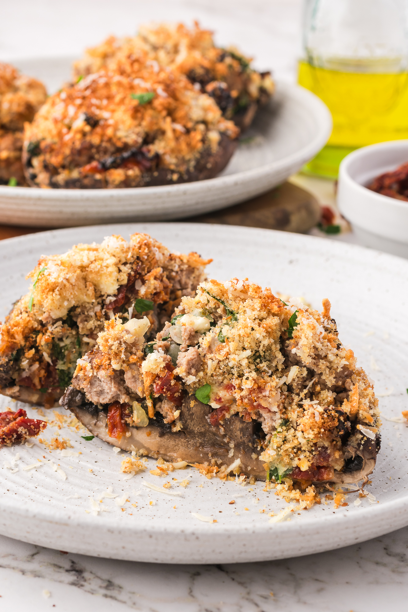 A Stuffed Portobello Mushrooms sliced in half.