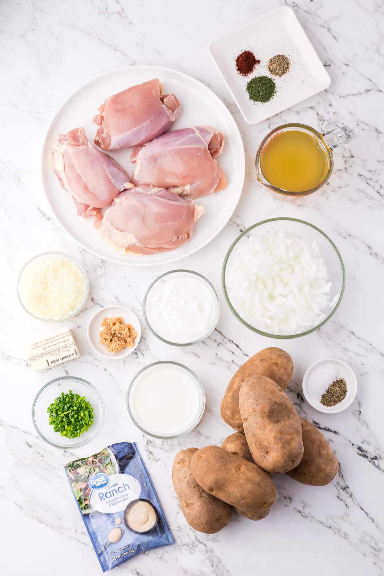 A mis-en-place of ingredients for Slow Cooker Ranch Chicken.