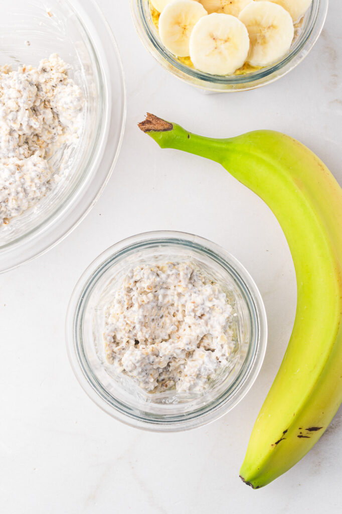 The overnight oat mixture next to a banana.