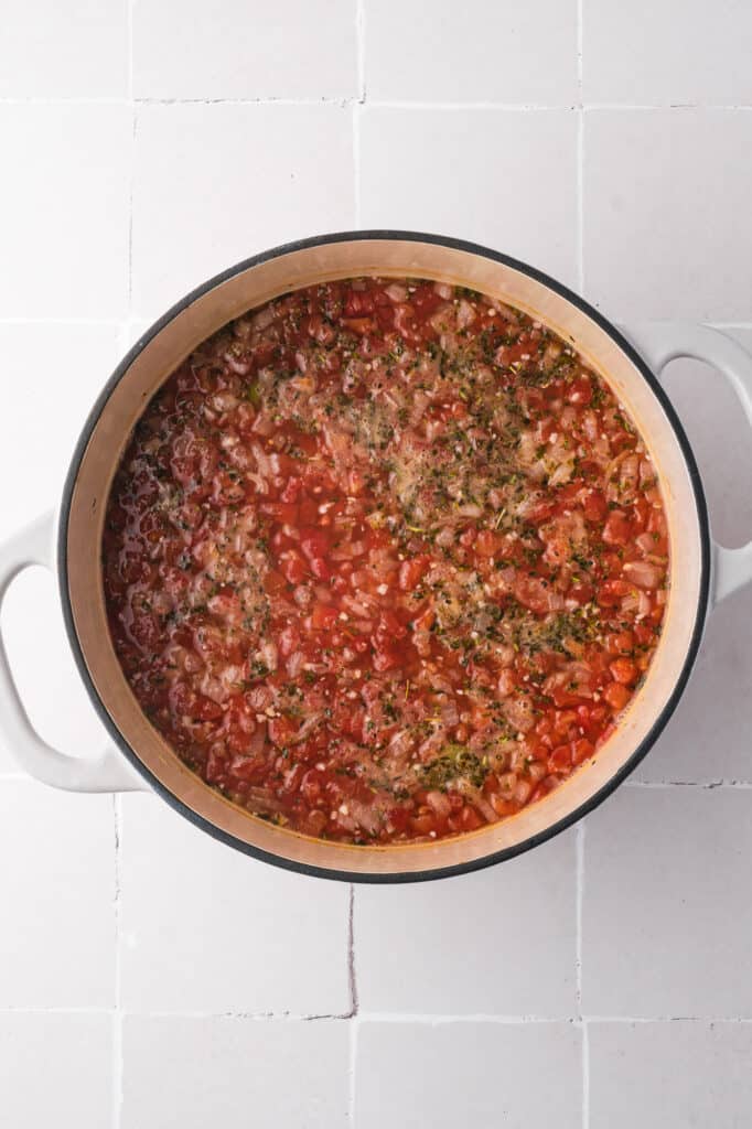 A pot holding all the ingredients for Sausage Minestrone Soup before cooking.