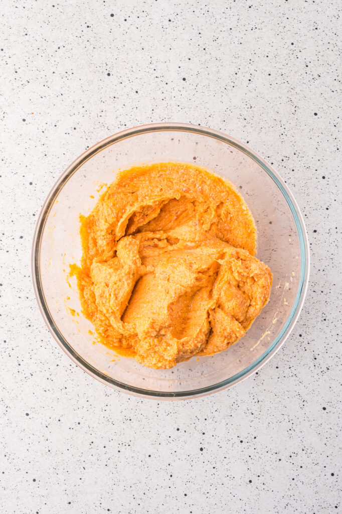 A bowl of mashed sweet potatoes with ricotta, egg, Parmesan, salt, and nutmeg.