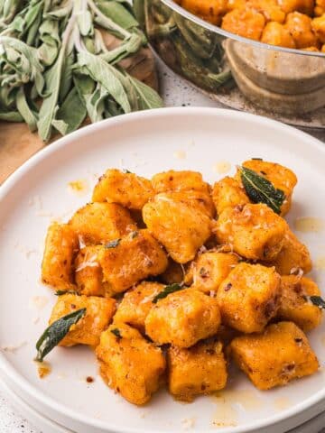 A plate of Sweet Potato Gnocchi with Sage Brown Butter Sauce.