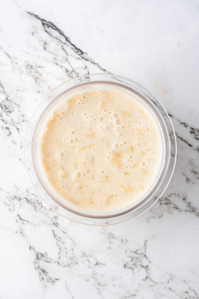 The ice cream mixture in the pint container of the Ninji Creami before freezing.